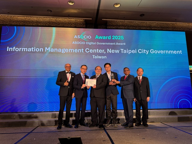 Figure 1: The Information Management Center Director Chen Fu-Tien (third left) and Chief Tang Shih-Jie (third right) represent the New Taipei City Government at the ASOCIO Awards 2025 ceremony, with Taiwan Innovative Software and Services Association Chairman Brian Shen (second left) and ASOCIO Lifetime Honorary Chairman Abdullah Kafi (second right) presenting the award while Chairman Stan Singh (far left) and Lifetime Honorary Chairman Bunrak Saraggananda (far right) witness the ceremony.